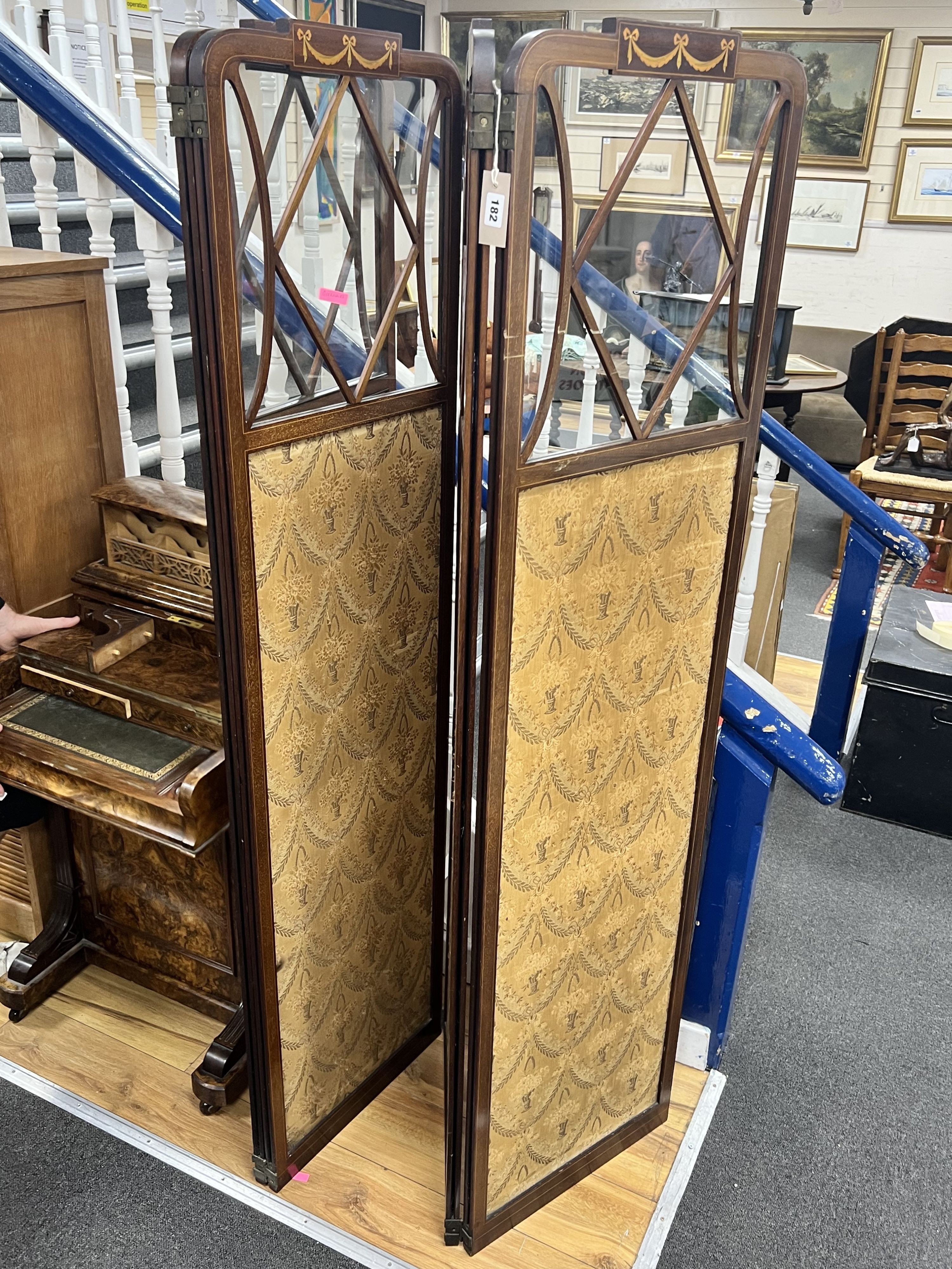 An Edwardian inlaid mahogany four fold part glazed dressing screen, each panel width 46cm height 178cm